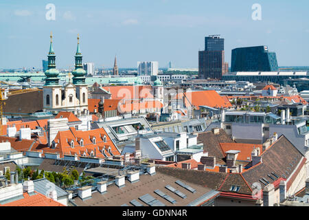 Panorama with Jesuit Church, City Tower and Wien Mitte building from north tower of St. Stephen's Cathedral in Vienna, Austria Stock Photo