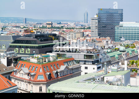 Panorama with rooftop cafe, Flak Towers, Millennium Tower and Raiffeisen House off north tower of St. Stephen's Cathedral in Vie Stock Photo