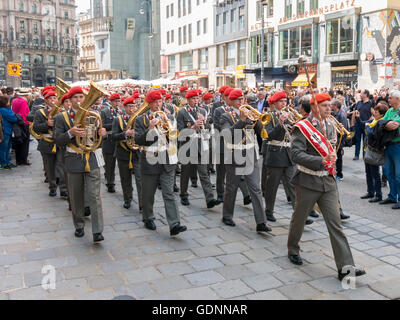 Marching brass band in procession on Stephansplatz in Vienna on Corpus Christi holiday, Austria Stock Photo