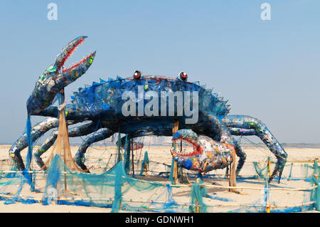 The Mad Crab on the beach, an installation art with Waste Plastics. Plastics and similar non-bi Stock Photo