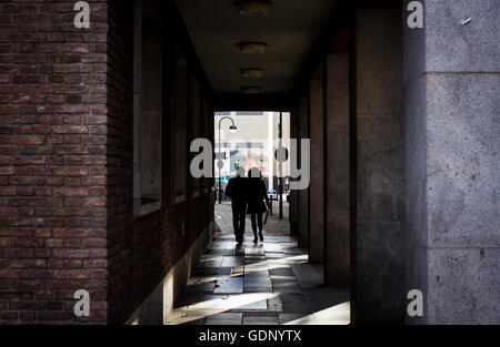 Van Gogh's eyes follow a couple walking in Cologne, Germany. Stock Photo