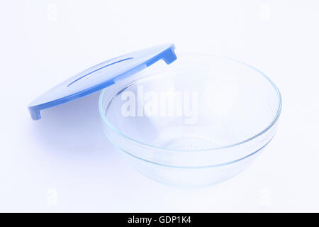 glass food container with blue plastic lid isolated on white background Stock Photo