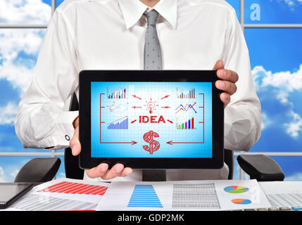 businessman holding touch pad with idea concept on screen Stock Photo