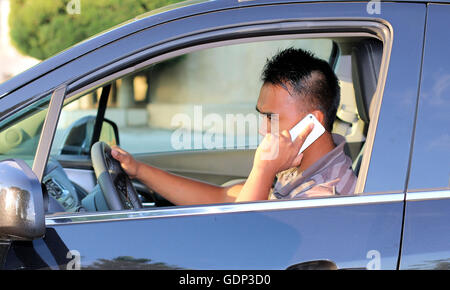 Young man calling during he drives Stock Photo