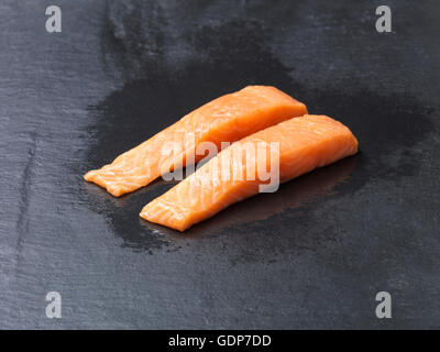 Food, raw fish, two line caught natural salmon fillets on slate Stock Photo
