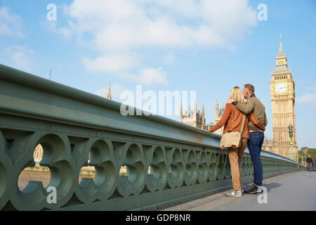Couple on westminster bridge looking at view Stock Photo