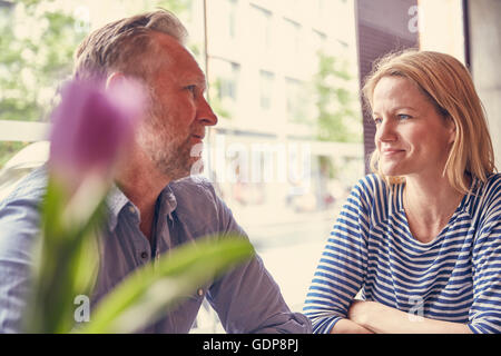 Mature couple in coffee shop chatting Stock Photo
