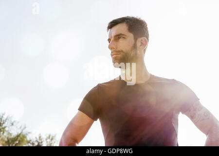 Portrait of mid adult man, outdoors, looking away Stock Photo