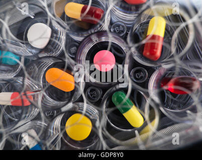 Pharmaceutical research, overhead close up of  variety of medical drugs in a multi well tray for laboratory testing