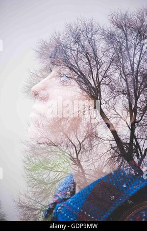 Young woman, side view and trees Stock Photo