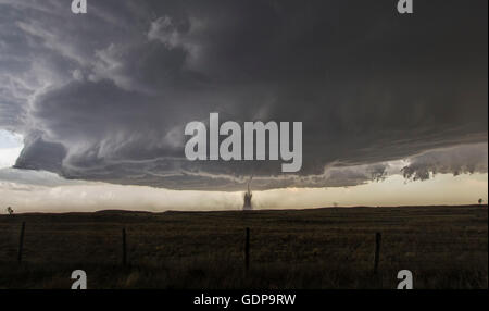 Full structure of tornado, parent wall cloud and storm Stock Photo