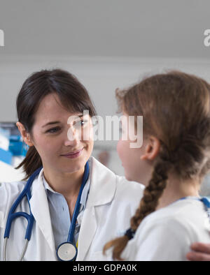 Pediatrician consulting with girl Stock Photo