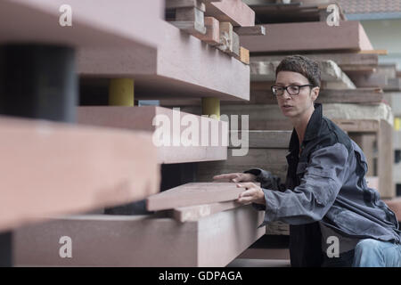 Stonemason quality checking blocks of stone Stock Photo