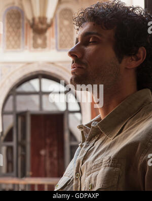 Portrait of young man, eyes closed, Marrakesh, Morocco Stock Photo