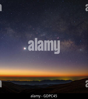 Milky Way and Venus shine among the morning twilight. Stock Photo