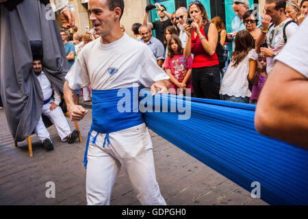 People prepare to carry the giants during La Merce Festival, in Ferran street.  Barcelona. Catalonia. Spain Stock Photo