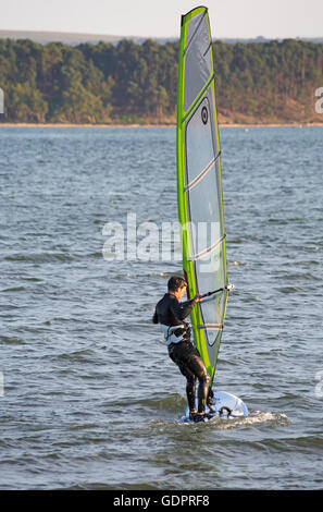 Wind surfer at Poole, Dorset on a warm evening in July Stock Photo