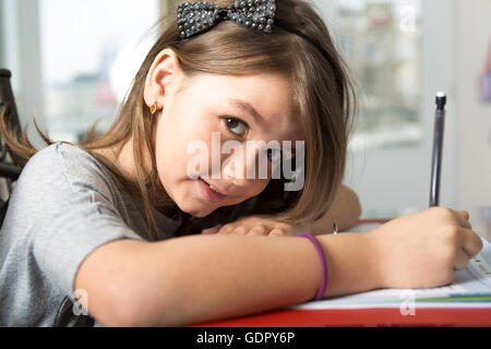 Teenage girl doing homework for school. Stock Photo