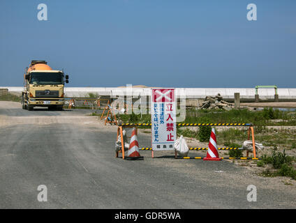 No entry sign in front of a truck in the highly contaminated area after the tsunami and the daiichi nuclear power plant irradiation, Fukushima prefecture, Namie, Japan Stock Photo