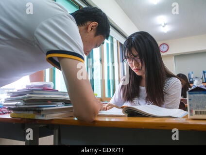 North korean teen defector with her teatcher in yeo-mung alternative school, National capital area, Seoul, South korea Stock Photo