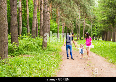 Family Walking Along Summer Path Stock Photo