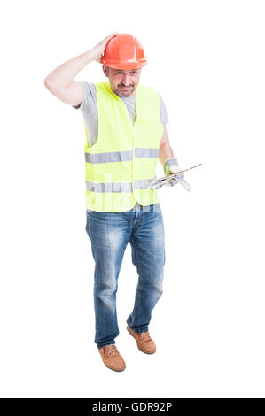 Full body of male builder with tablet looking confused or doubtful isolated on white background Stock Photo