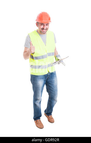 Cheerful male builder with tablet showing thumb up or like gesture isolated on white background Stock Photo