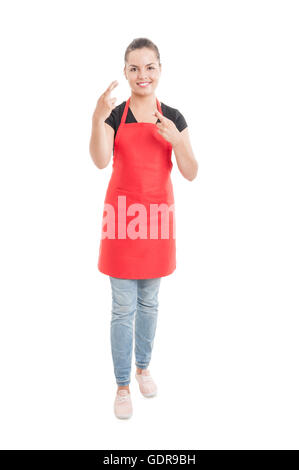 Full body of pretty hypermarket employee doing double luck gesture isolated on white background Stock Photo