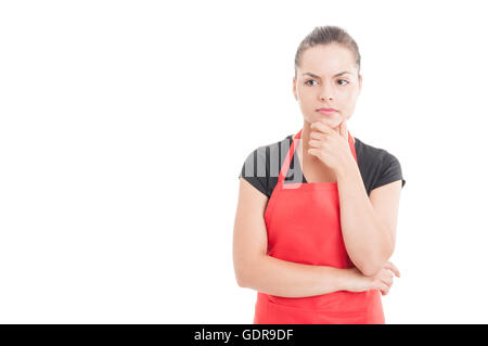 Portrait of supermarket female employee thinking at something isolated on white with copy space Stock Photo