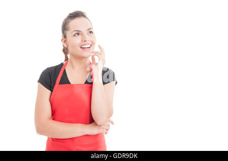 Beautiful female employee with work apron having a great idea and smiling joyful isolated onn white with copyspace Stock Photo