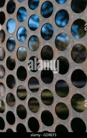 Metallic fence with a circular pattern Stock Photo - Alamy
