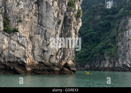 Man kayaking in Ha Long Bay Stock Photo