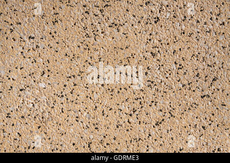 Yellow stone with small pebbles in it - Pattern background image. Stock Photo