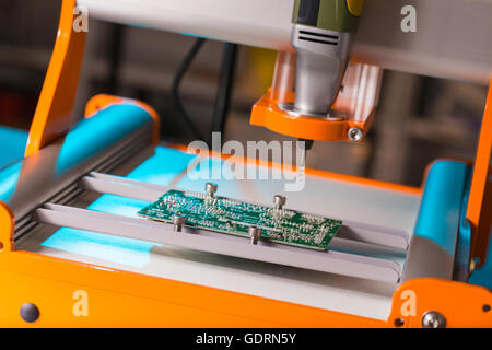 PCB Processing on CNC machine Stock Photo