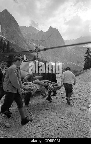 Rescue helicopter during a mission in the mountains, 1970 Stock Photo