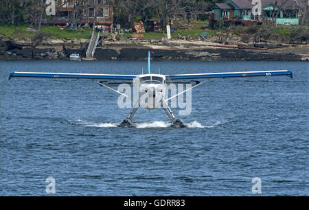 Harbour Air Float Plane arriving at Nanaimo landing stage on Vancouver Island. BC Canada.  SCO 10,750. Stock Photo