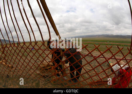 Hami, Hami, China. 16th July, 2016. Hami, China - July 16 2016: (EDITORIAL USE ONLY. CHINA OUT) Kazakh people live in yurts so that they can move to other plateaus conveniently. A traditional yurt (from the Turkic languages) or ger (Mongolian) is a portable, round tent covered with skins or felt and used as a dwelling by nomads in the steppes of Central Asia. The structure comprises an angled assembly or latticework of pieces of wood or bamboo for walls, a door frame, ribs (poles, rafters), and a wheel (crown, compression ring) possibly steam-bent. The roof structure is often self-supporting, Stock Photo