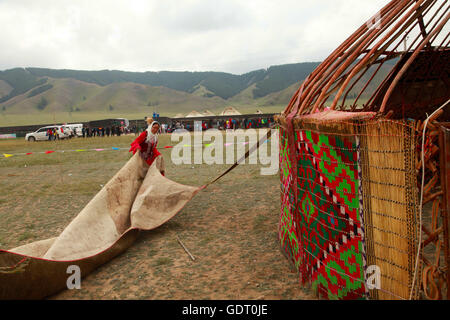 Hami, Hami, China. 16th July, 2016. Hami, China - July 16 2016: (EDITORIAL USE ONLY. CHINA OUT) Kazakh people live in yurts so that they can move to other plateaus conveniently. A traditional yurt (from the Turkic languages) or ger (Mongolian) is a portable, round tent covered with skins or felt and used as a dwelling by nomads in the steppes of Central Asia. The structure comprises an angled assembly or latticework of pieces of wood or bamboo for walls, a door frame, ribs (poles, rafters), and a wheel (crown, compression ring) possibly steam-bent. The roof structure is often self-supporting, Stock Photo
