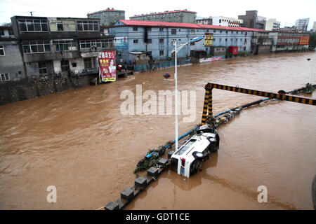 Jingxing, China's Hebei Province. 20th July, 2016. Photo taken on July 20, 2016 shows a waterlogged street in Jingxing County of Shijiazhuang City, north China's Hebei Province, July 20, 2016. Continuous heavy rain hit north China's Hebei Province for three days, causing 14 people dead, 72 missing and affecting 1.995 million people. Credit:  Wang Baolong/Xinhua/Alamy Live News Stock Photo