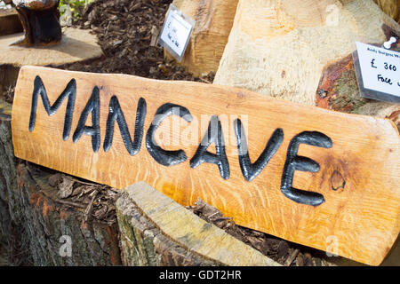 Tatton Park, Knutsford, UK. 21st July, 2016. Wooden carved Mancave sign at the RHS Tatton Park Flower Show, the north's greatest garden event held in the stunning grounds of Cheshire's 1,000 acre deer park.  For almost a decade Tatton Park has offered young designers the unrivalled opportunity to design & build a show design to help launch their horticultural careers.  Hundreds of exhibitors will show their garden designs & accessories to the thousand of visitors expected over the event.  Credit:  Cernan Elias/Ģ����ý Live News Stock Photo