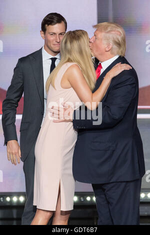 Cleveland, Ohio, USA. 21st July, 2016. GOP Presidential candidate Donald Trump kisses his daughter Ivanka Trump as husband Jared Kushner looks on after accepting the party nomination for president on the final day of the Republican National Convention July 21, 2016 in Cleveland, Ohio. Credit:  Planetpix/Alamy Live News Stock Photo