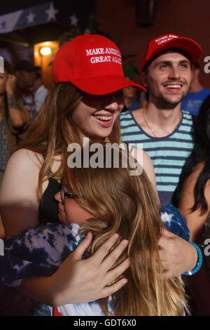 Cleveland, Ohio, USA. 21st July, 2016. Cleveland, Ohio, USA. 21st July, 2016. Sisters Marrisa and Emma, ages 17 and 9, from Clevelend hug during Trump's speech outside of the convention hall. © John Orvis/Alamy Live News Credit:  John Orvis/Alamy Live News Stock Photo