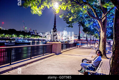 People on The Southbank at Night London UK Stock Photo