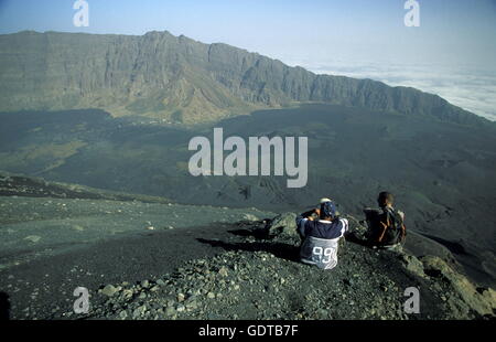 Tourists on the top of the Fogo Village on the Volcano Fogo on the Island Fogo on Cape Verde in the Atlantic Ocean in Africa. Stock Photo