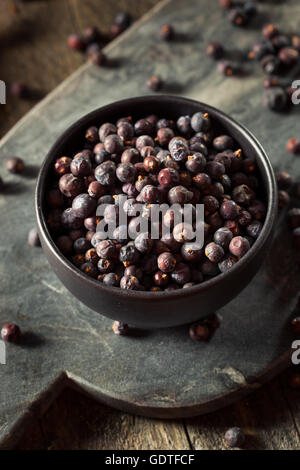 Raw Organic Juniper Berries in a Bowl Stock Photo