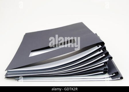 Pile of folders on plain background Stock Photo