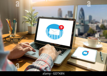 Man using laptop with blank screen see email icon, coffee Stock Photo