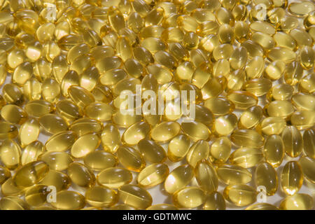 Hundreds of  Vitamin D soft gel capsules. Stock Photo