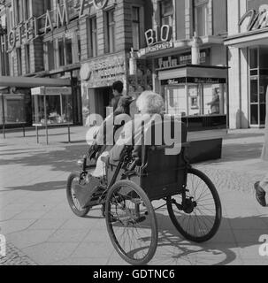 Elderly man with an eagle in Berlin, 1964 Stock Photo