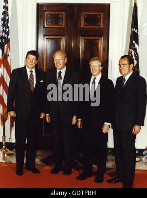 Full length portrait of President Ronald Reagan with former Presidents Gerald R. Ford, James E. Carter and Richard M. Nixon. Stock Photo